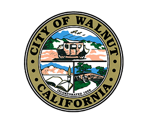 A circular logo featuring the text "CITY OF WALNUT, CALIFORNIA, INCORPORATED 1959" within it, serving as an emblem or symbol for the city.