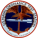 Logo of the U.S. Naval Ordnance Test Station, located in China Lake, California. The emblem features an eagle perched on a missile, over a backdrop of an anchor, symbolizing military strength, naval power, and the station's mission in weapons testing and development.